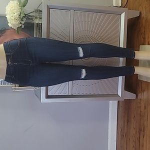 Gently used size 7 denim jeans with distress on the knees